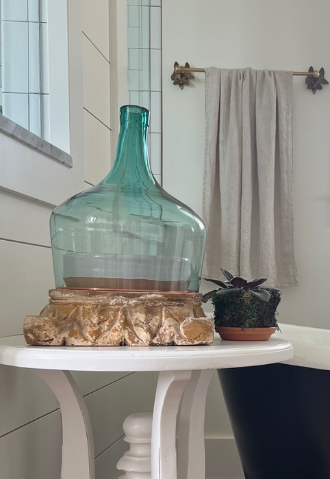 carved wood pillar base with demijohn cloche