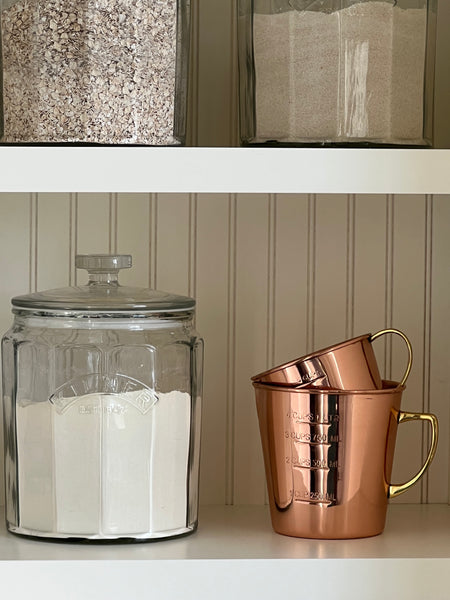 copper and brass measuring cups