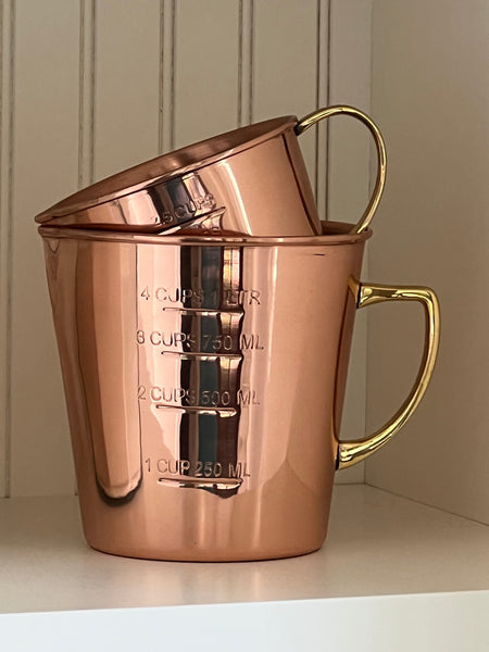 copper and brass measuring cups